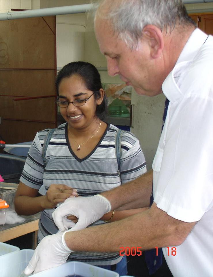 Nicole Sookoo and John Cooper sampling water (Photo Margaret Cooper)